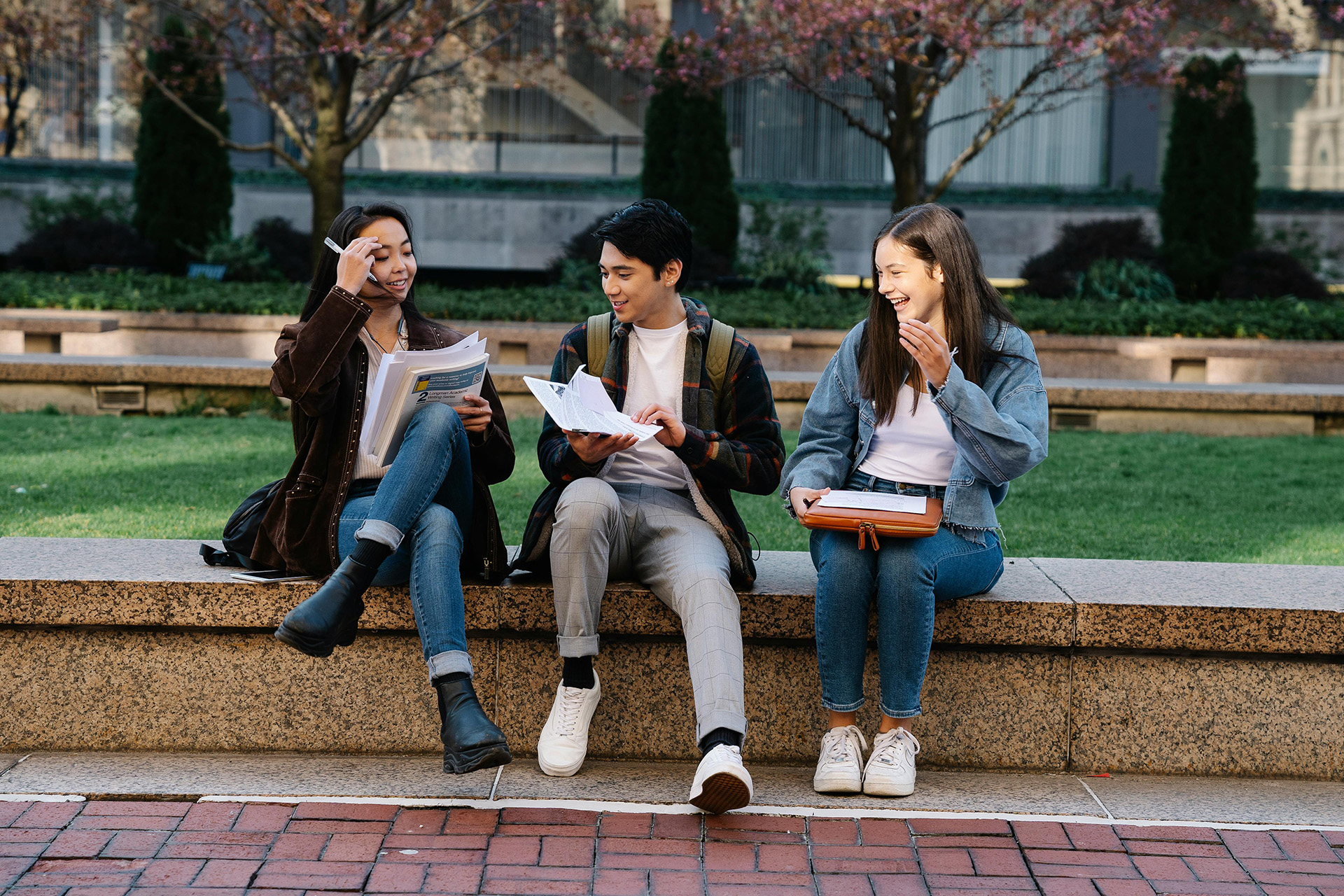 Students sat on the wall outside school