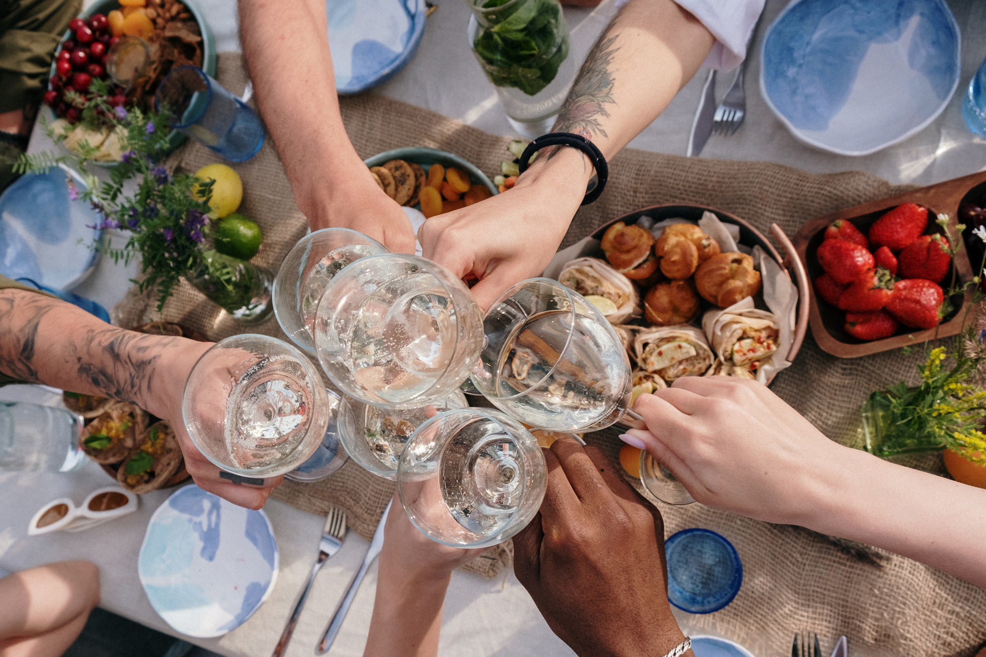 A group of people toasting glasses of wine