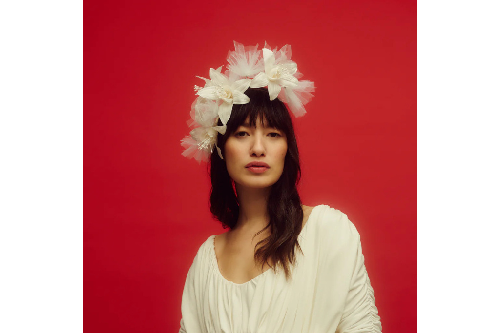 Woman wearing white floral headpiece