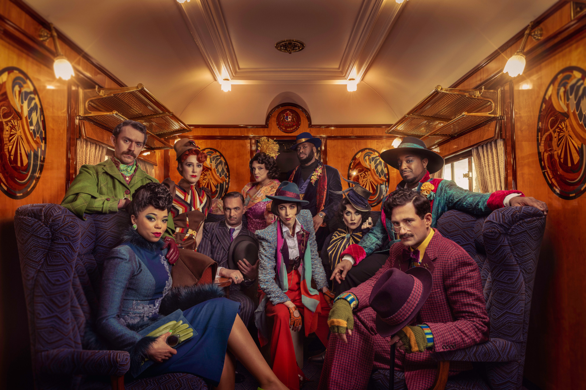 Actors on train in period costume