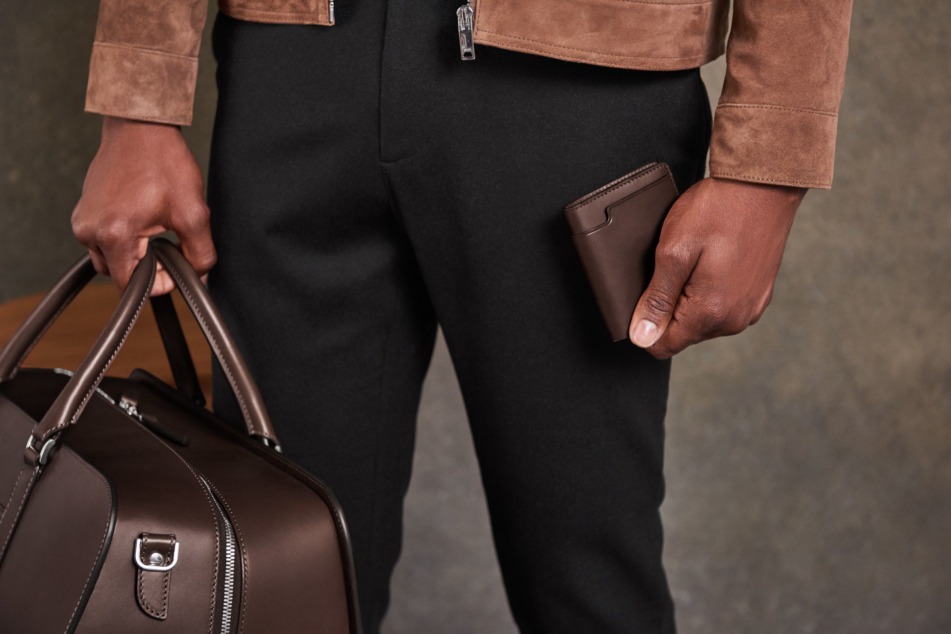 Close up of man holding brown bag
