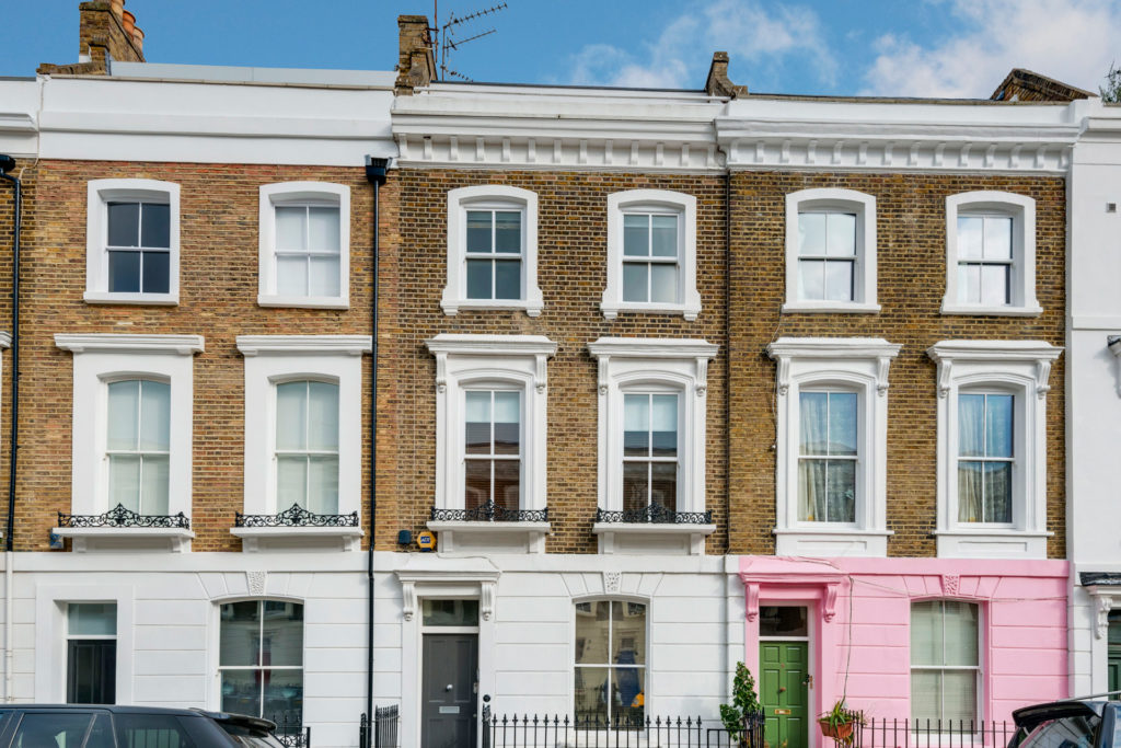 Terraced houses in Primrose Hill with white window frames.
