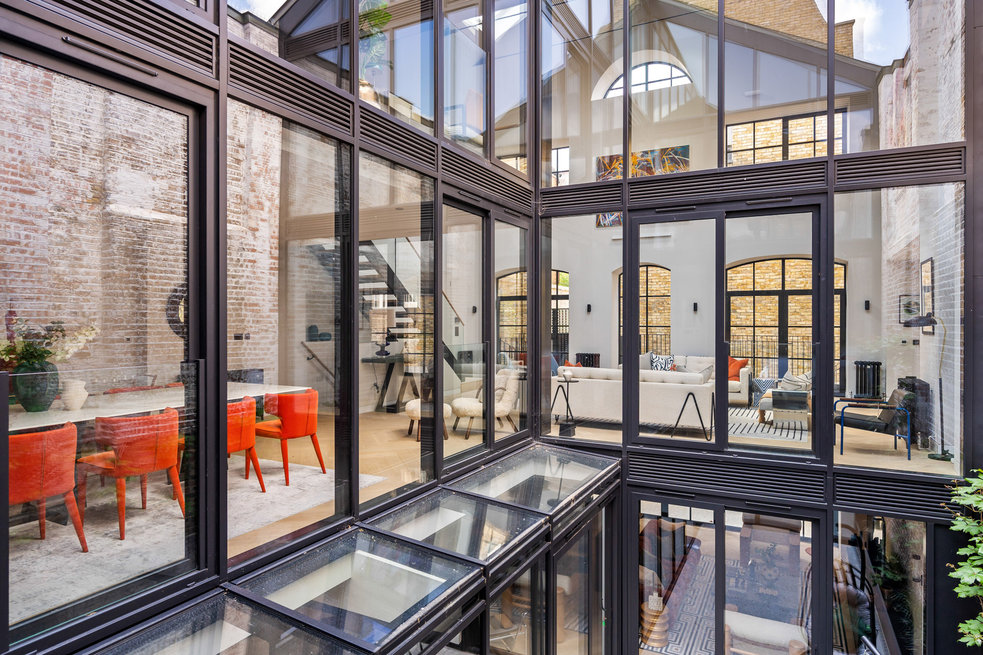 Victorian warehouse conversion with floor-to-ceiling windows.