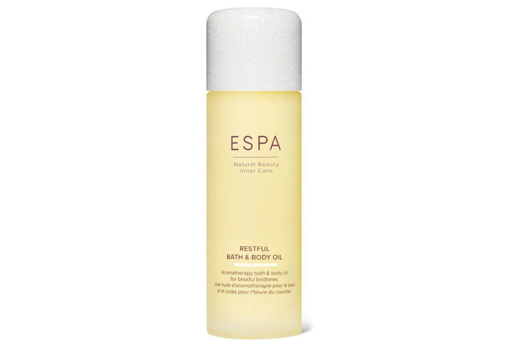 White and gold bottle of bath oil