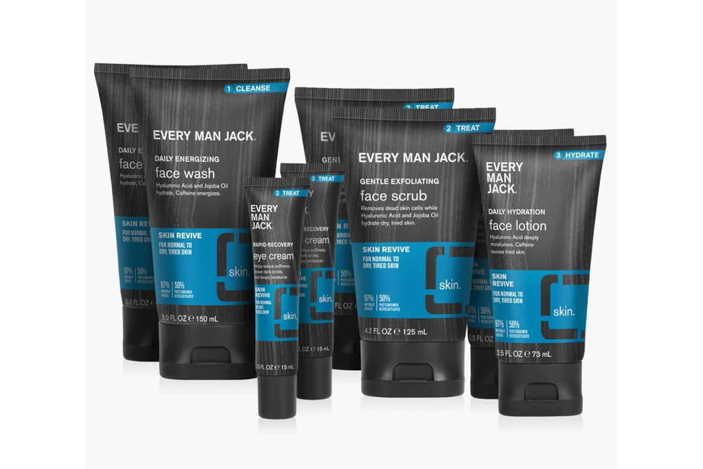 Grey and blue bottles and tubes of skincare