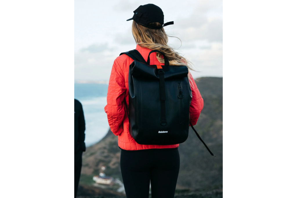 Woman wearing black rucksack