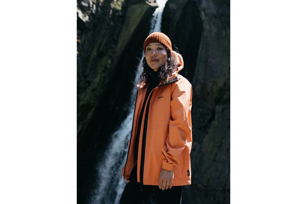 Woman in orange rain jacket