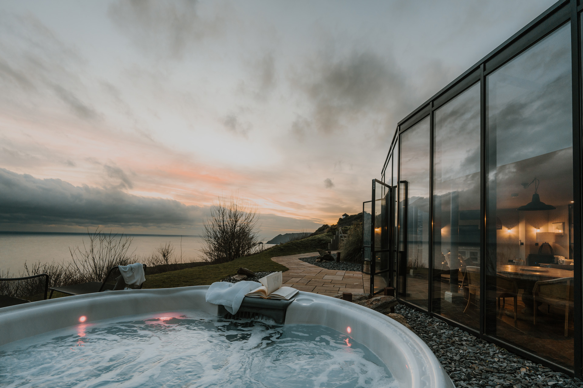 Hot tub on balcony with sunset views