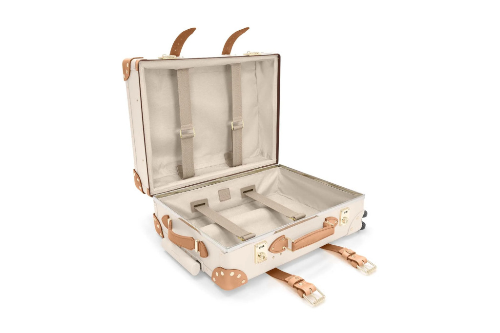 Cream case with brown leather straps and handles