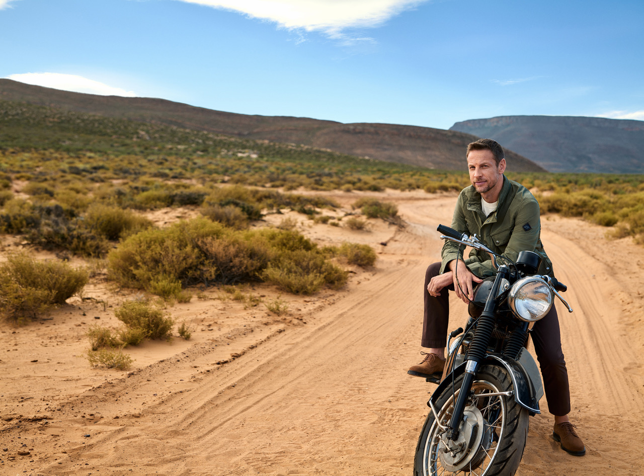 HACKETT X JENSON BUTTON SS23 on motorbike in desert