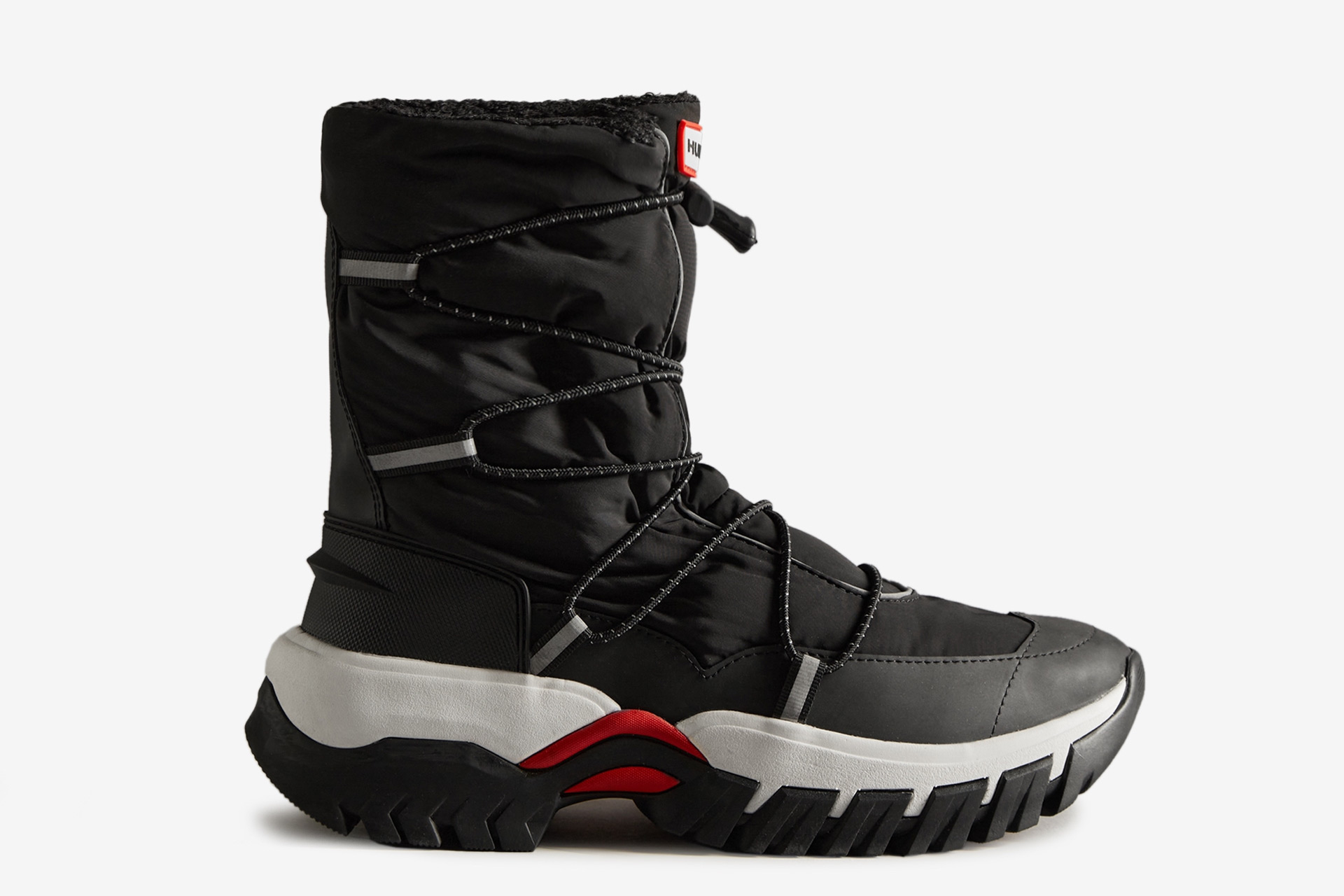 Black snow boots with white sole.