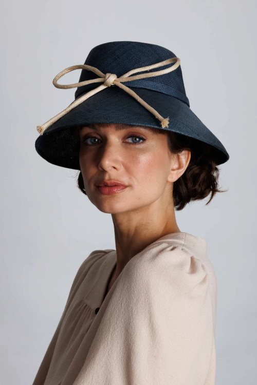 Woman wearing hat with ribbon