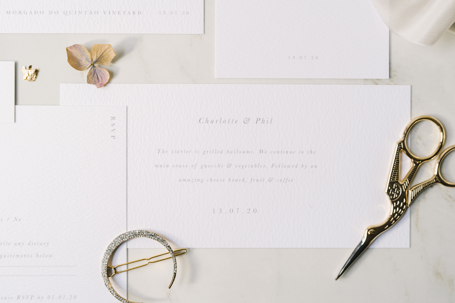 Wedding invites laid out on table