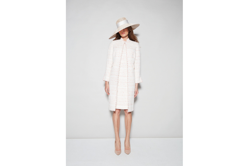 Woman in tweed coat dress and hat