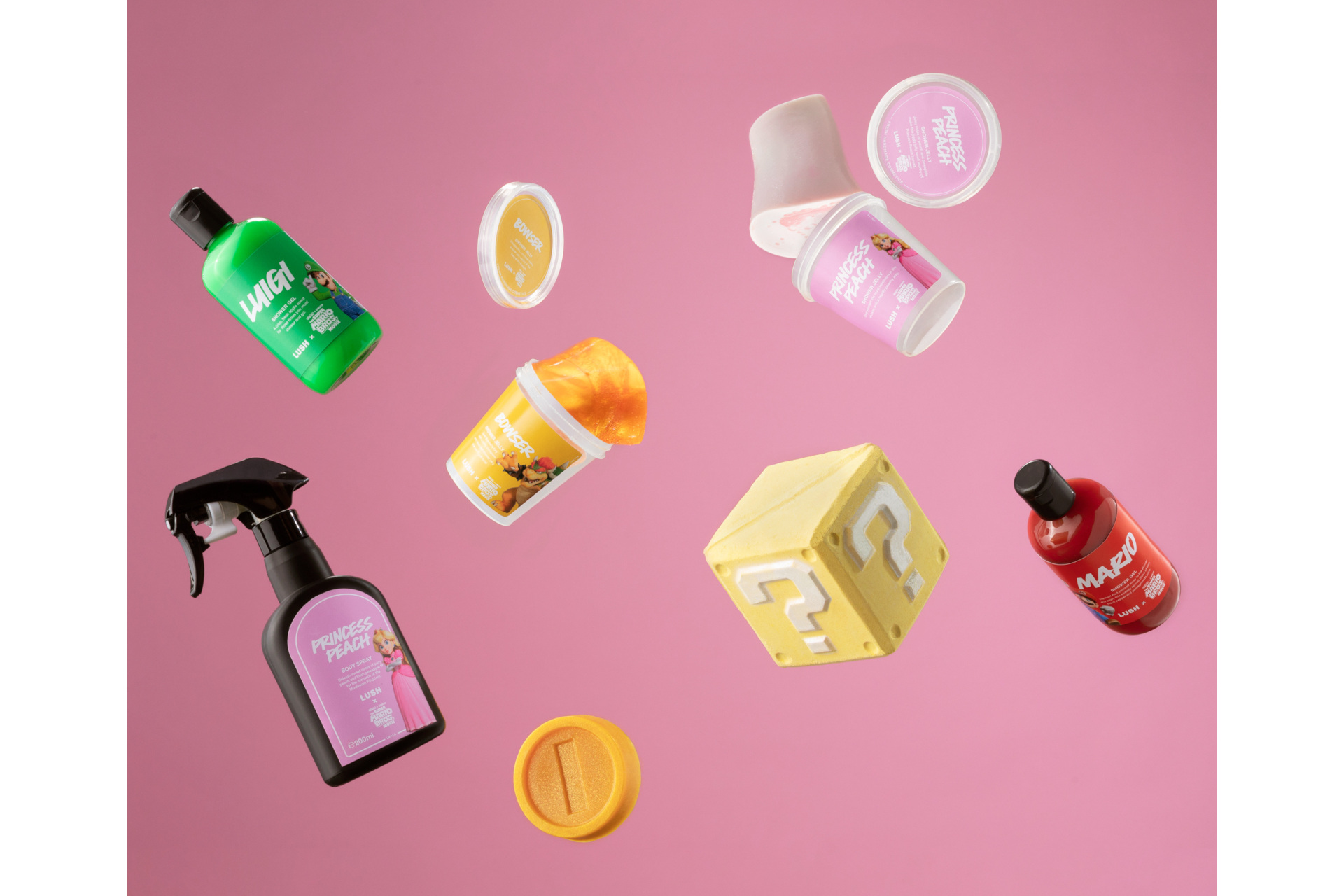 Lush x Super Mario Bros products falling through air in front of pink background