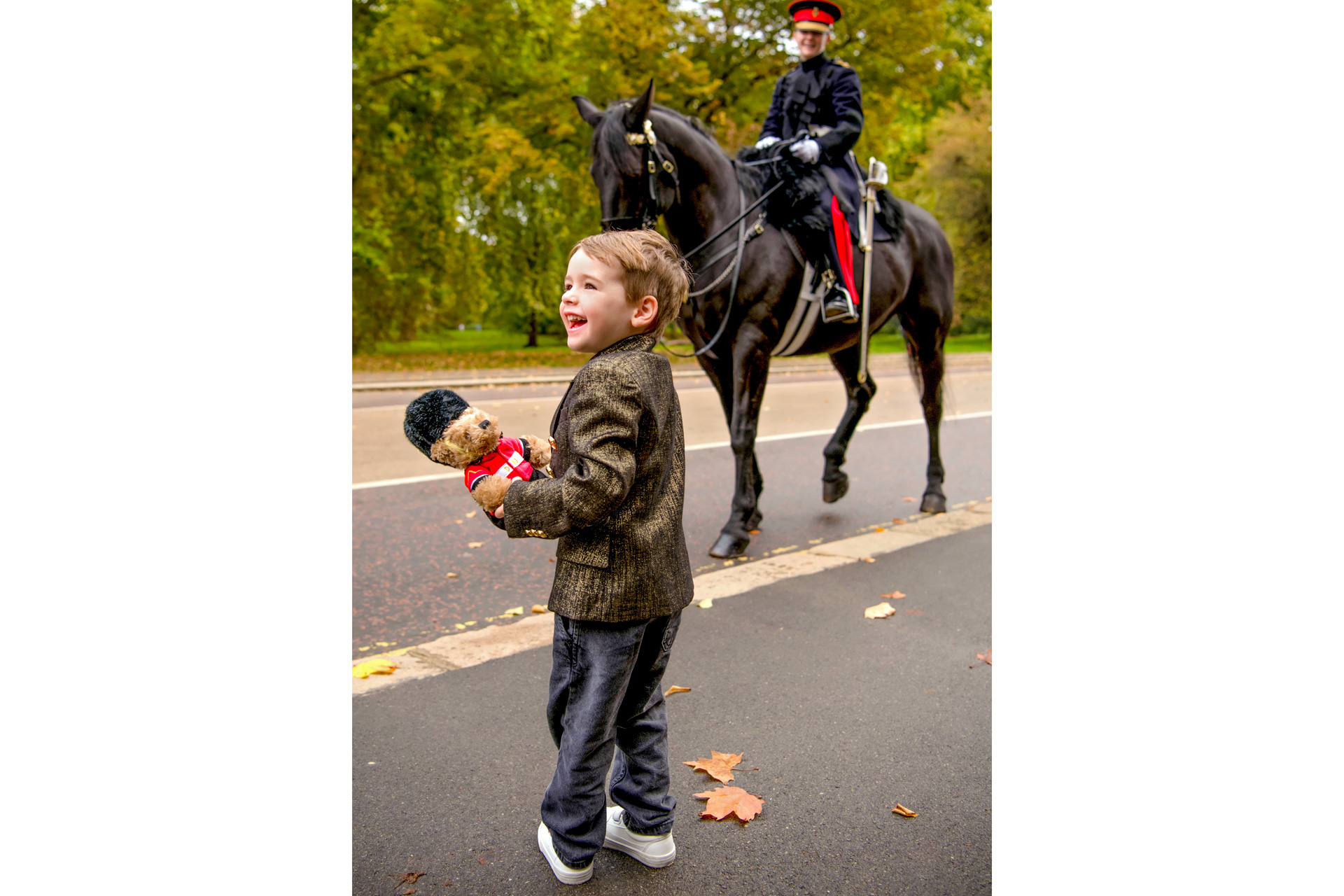 Child standing by a horse