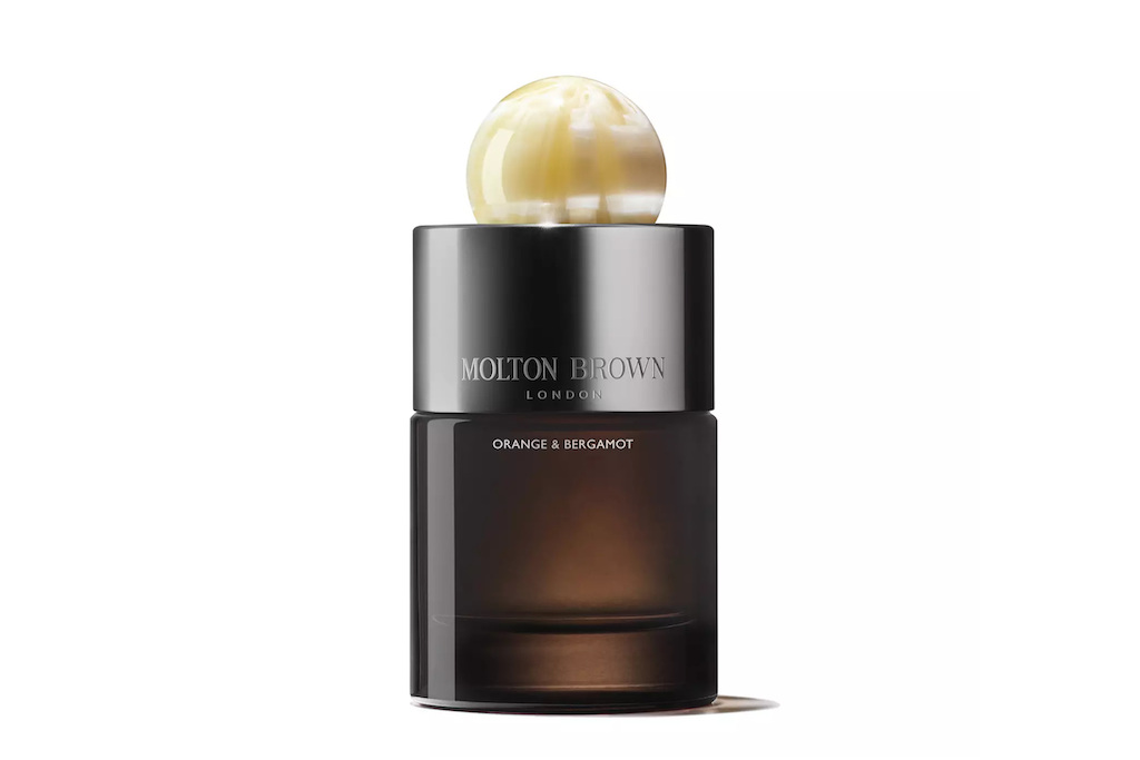 Brown and black bottle with pearl-like topper