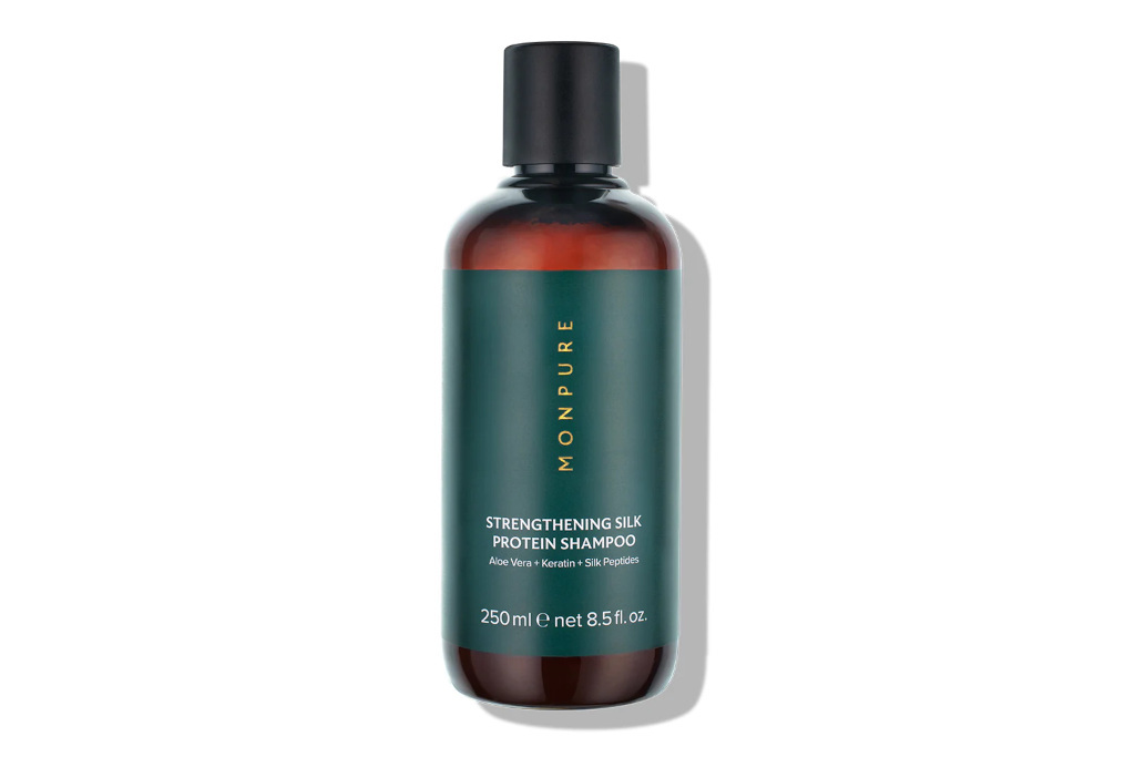 Brown shampoo bottle with green label and black cap
