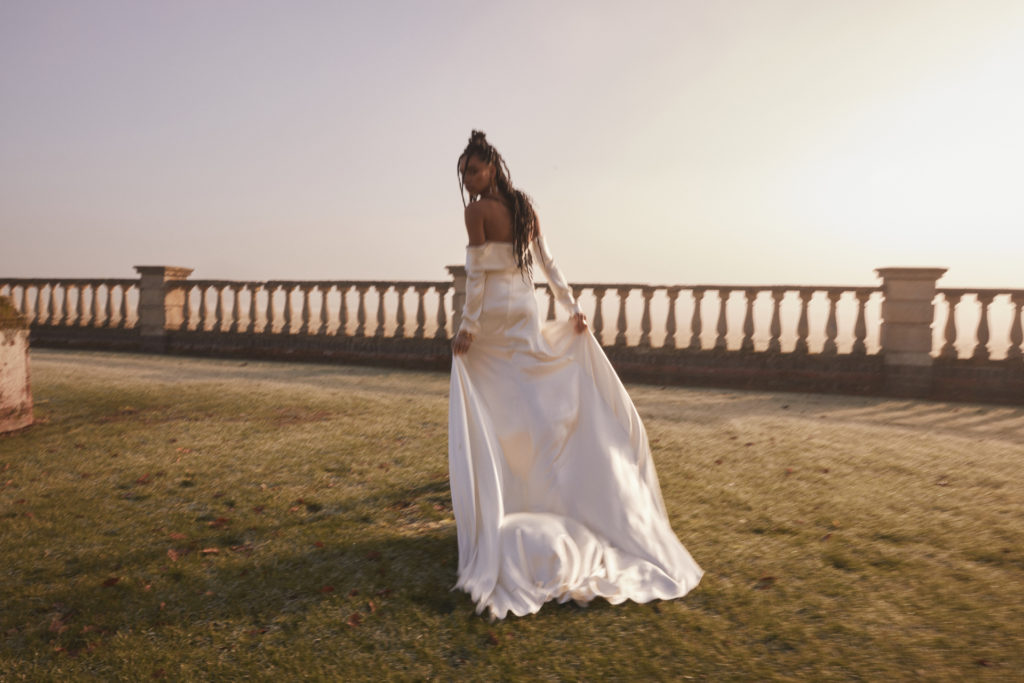 Woman on grass in wedding dress