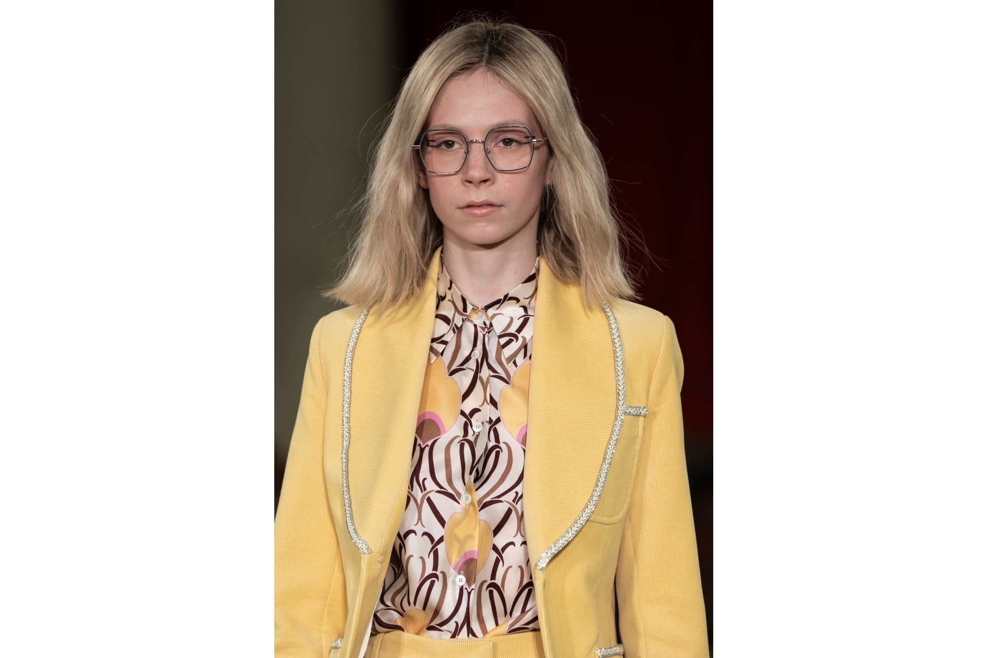 Woman wearing yellow blazer and shirt