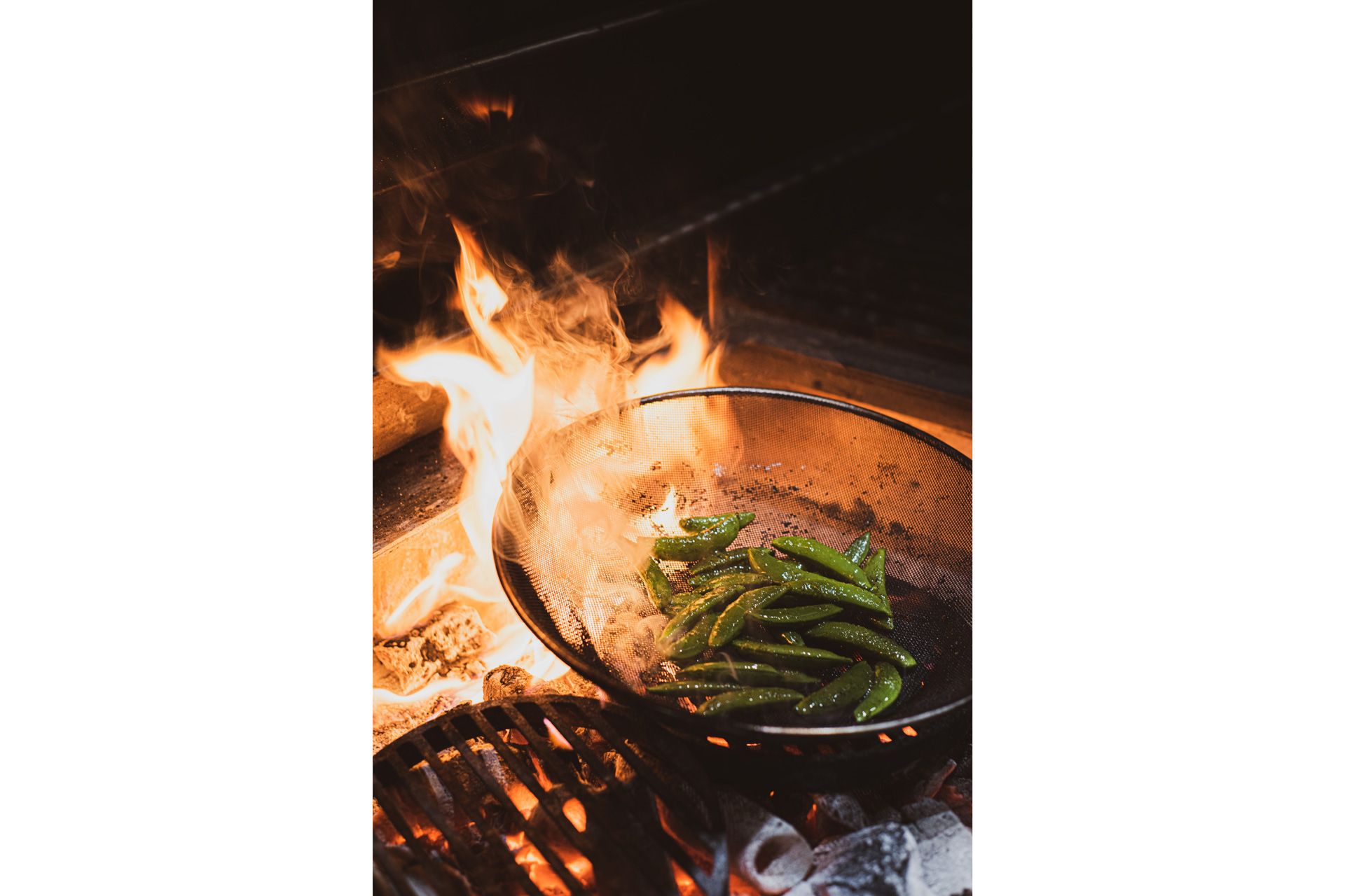 Food cooking on a open fire at Caia