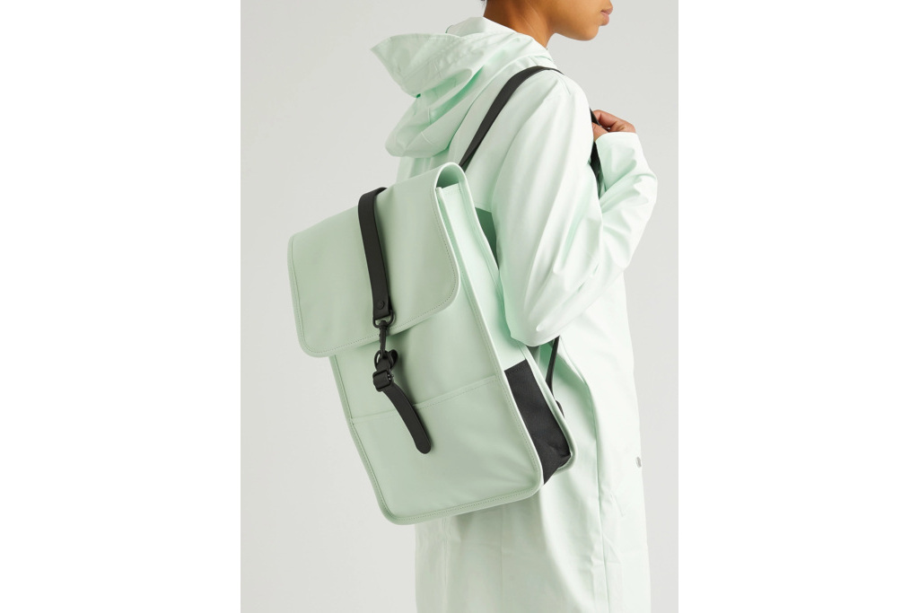 Person holding mint coloured waterproof bag