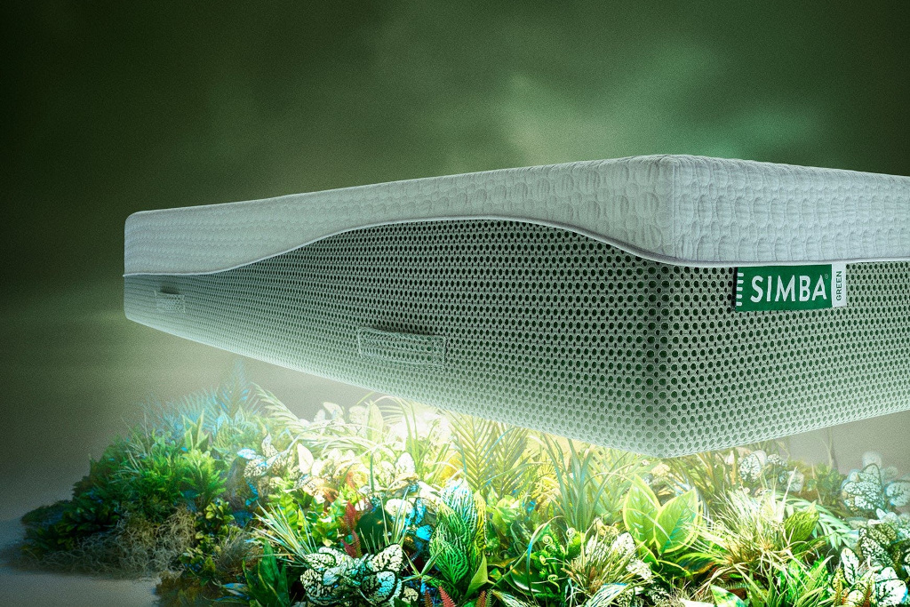 Mattress hovering above grass and plants