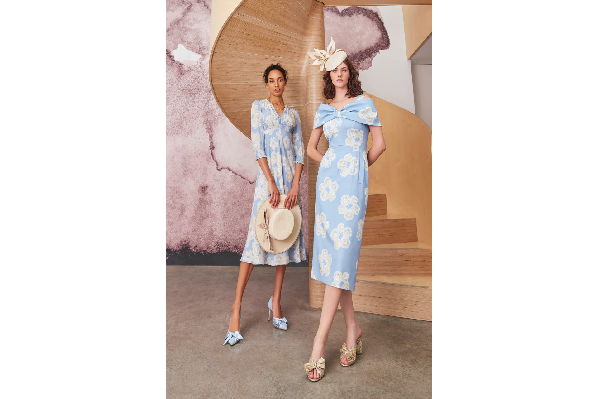 Two women in blue floral dresses