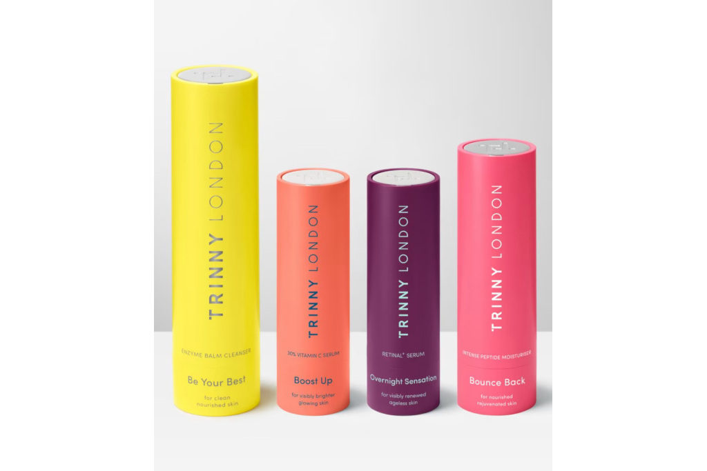 Four colourful tubes on white surface