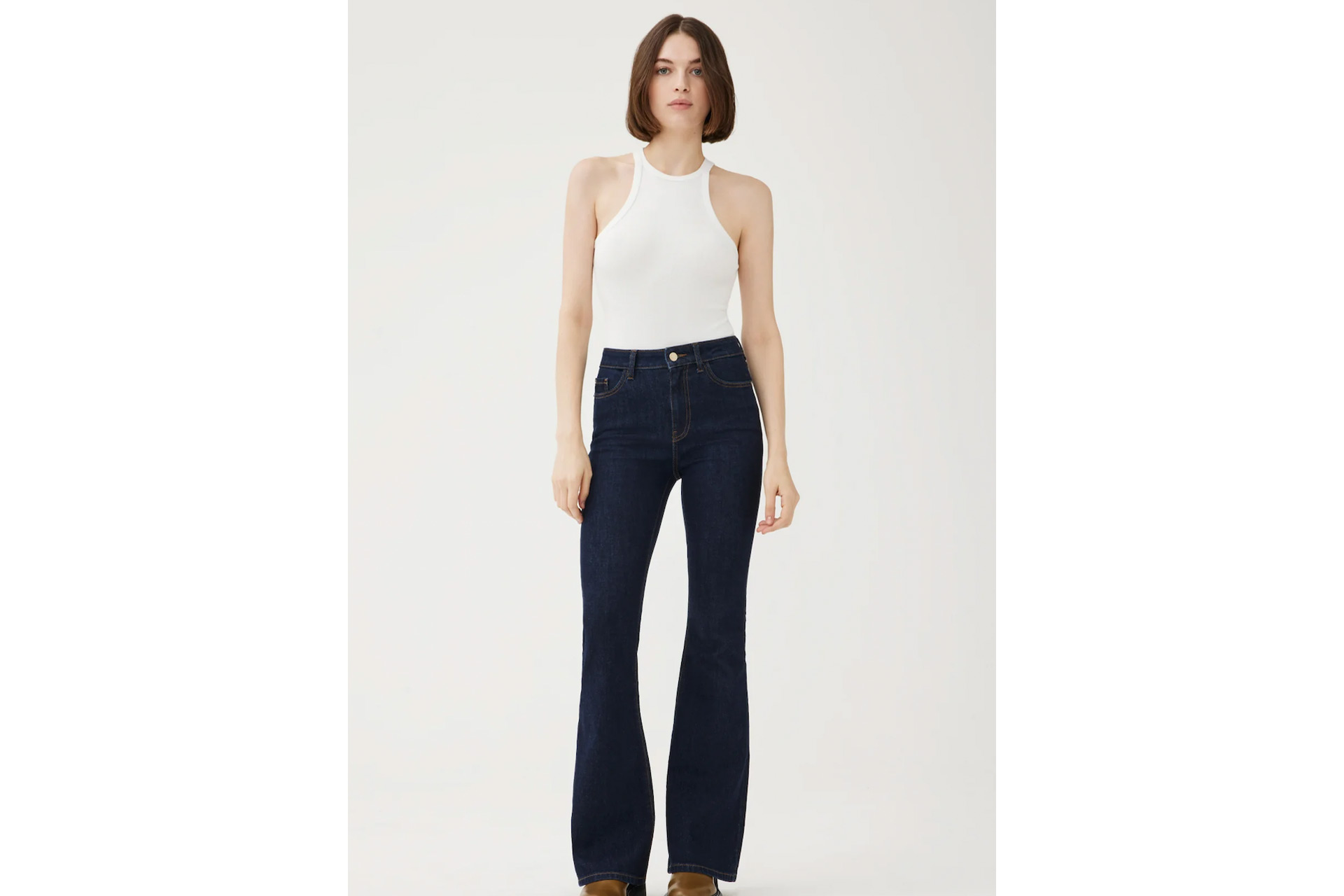 Dark denim flared jeans with white tank top