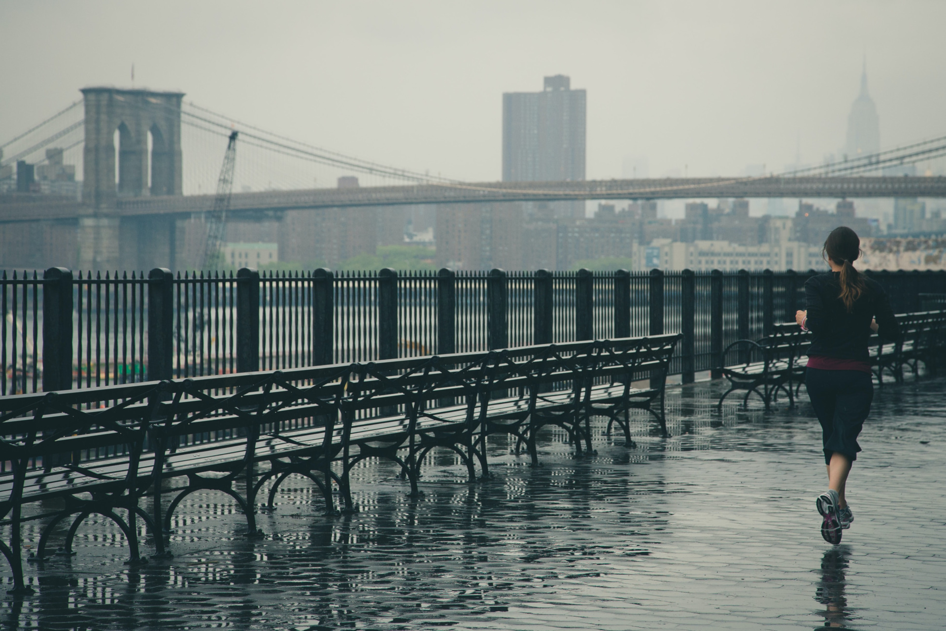 Woman running in the rain