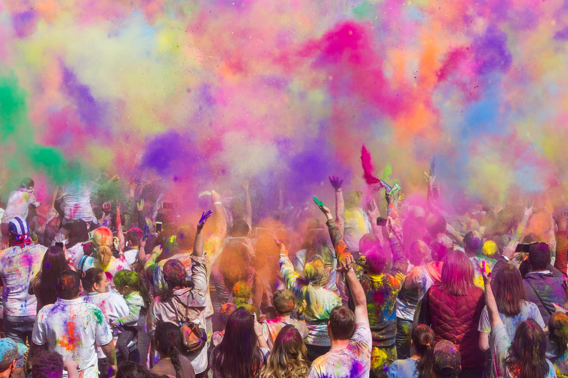 People throwing paint for Holi festival