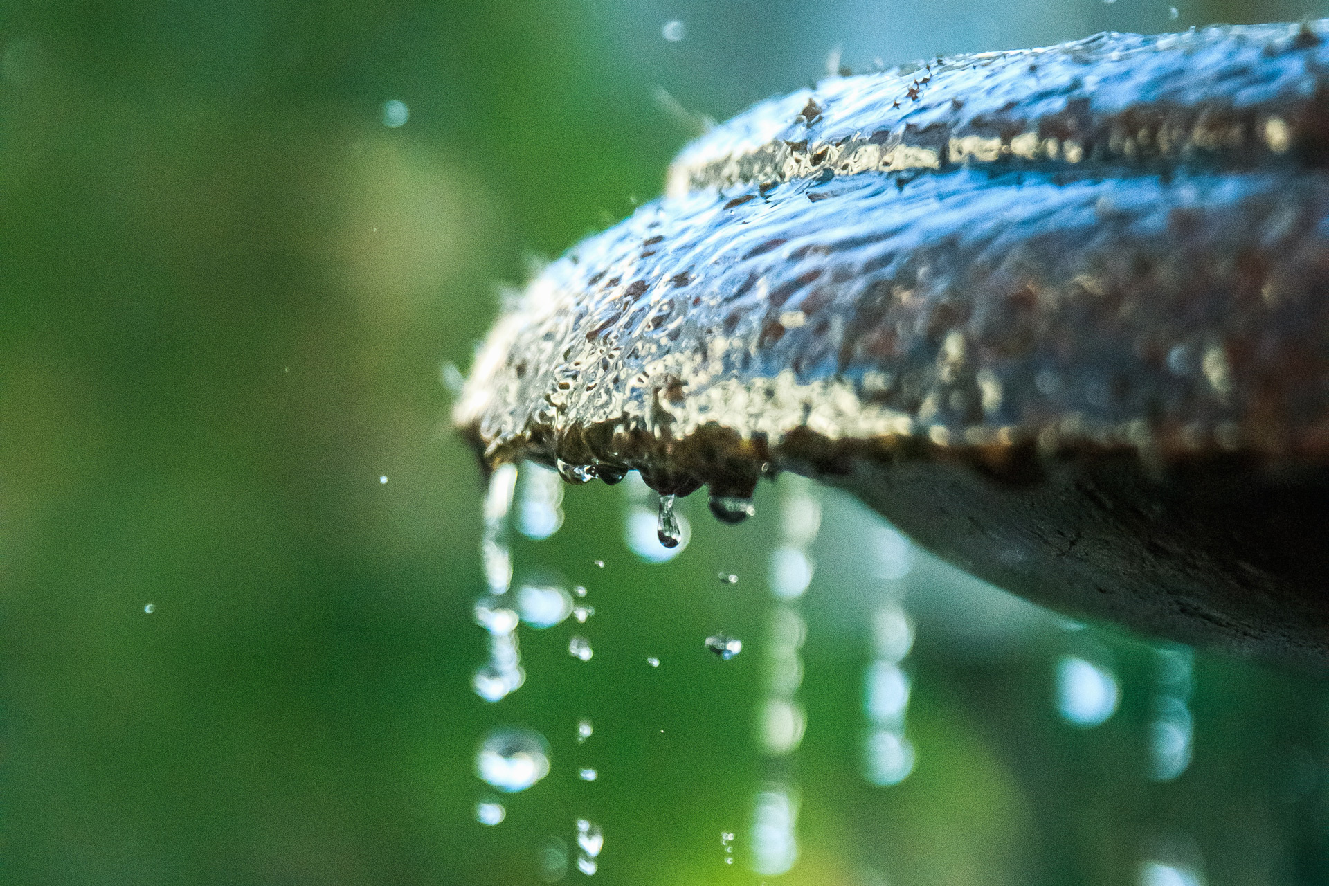 Water dripping from stone water fountain