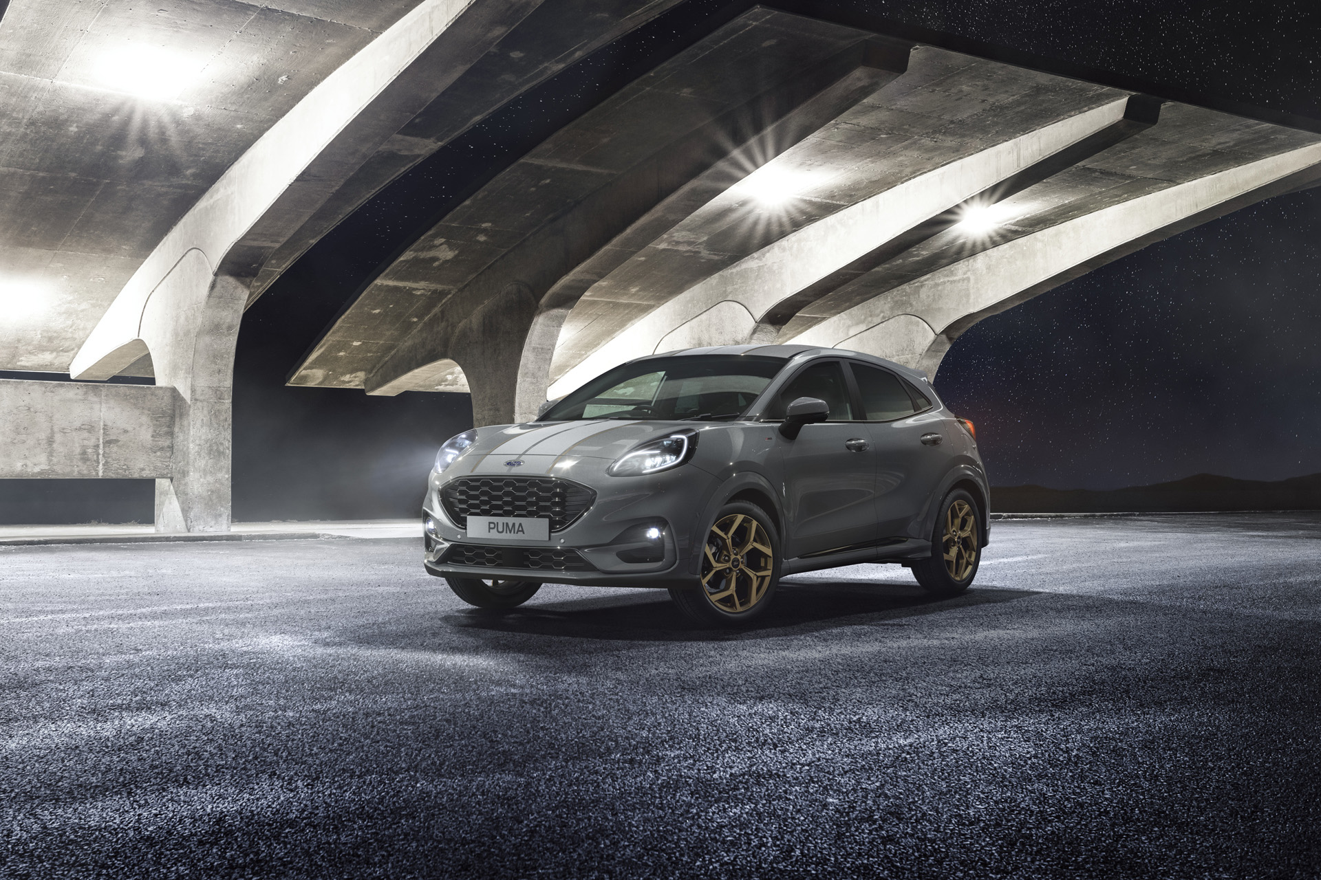 The Ford Puma ST-Line X Hybrid under a bridge