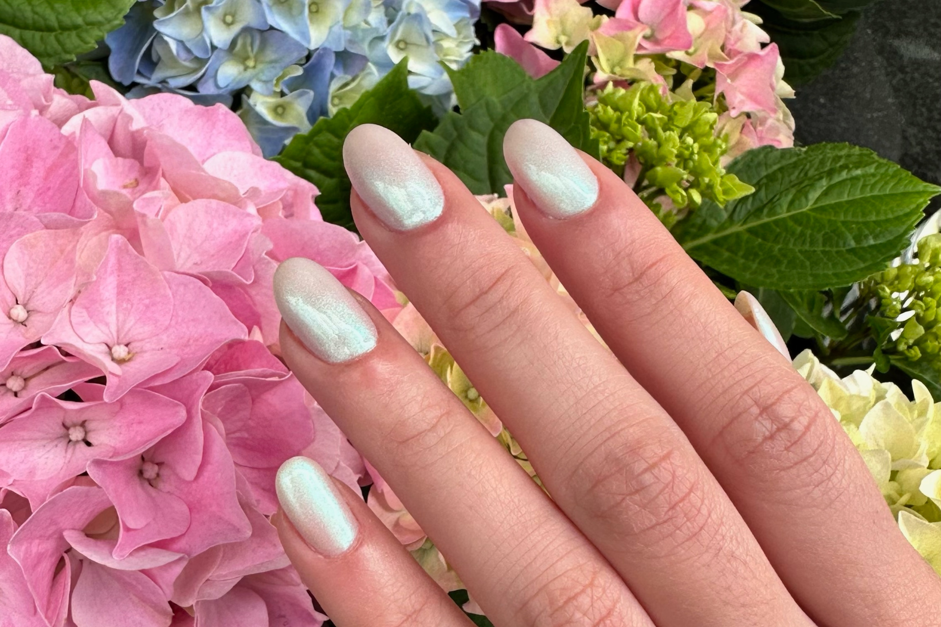 Wedding inspired nails, with hand held over flowers
