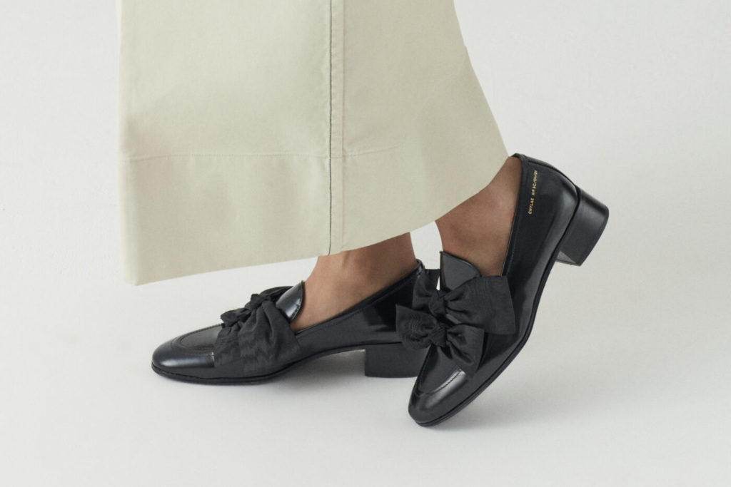 Close up of feet in black loafers