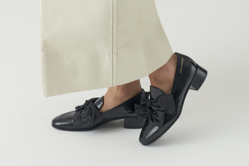 Close up of feet in black loafers