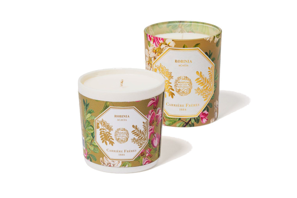Two candles with flowery sleeve