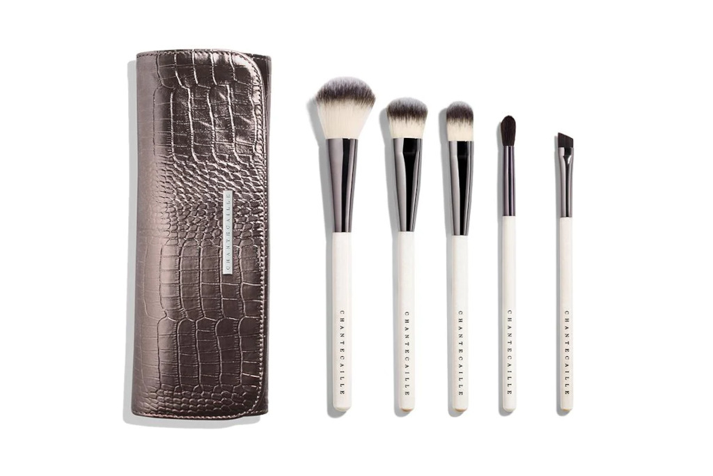 White brushes next to silver case