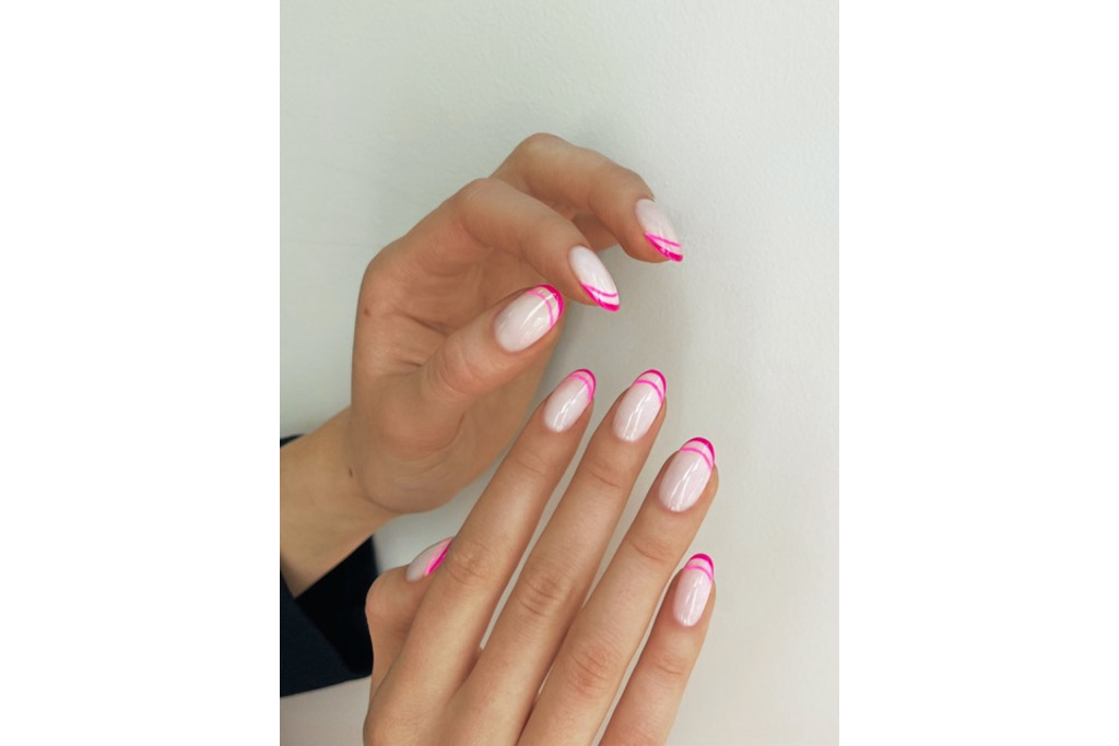 Close up of hands with pink nails