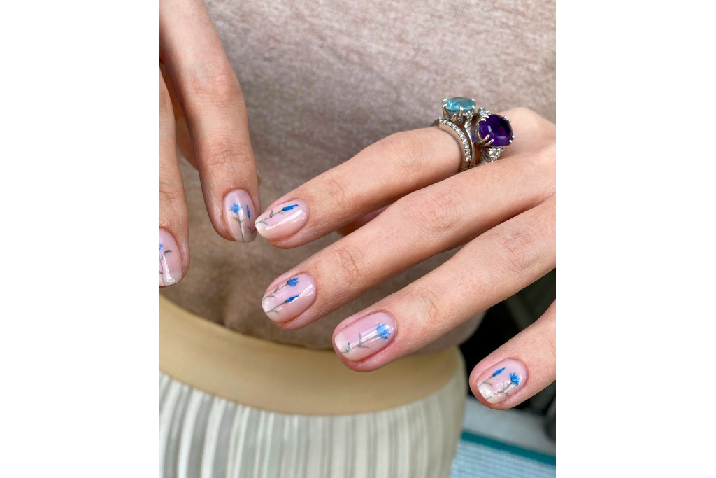 Close up of nails with blue flowers