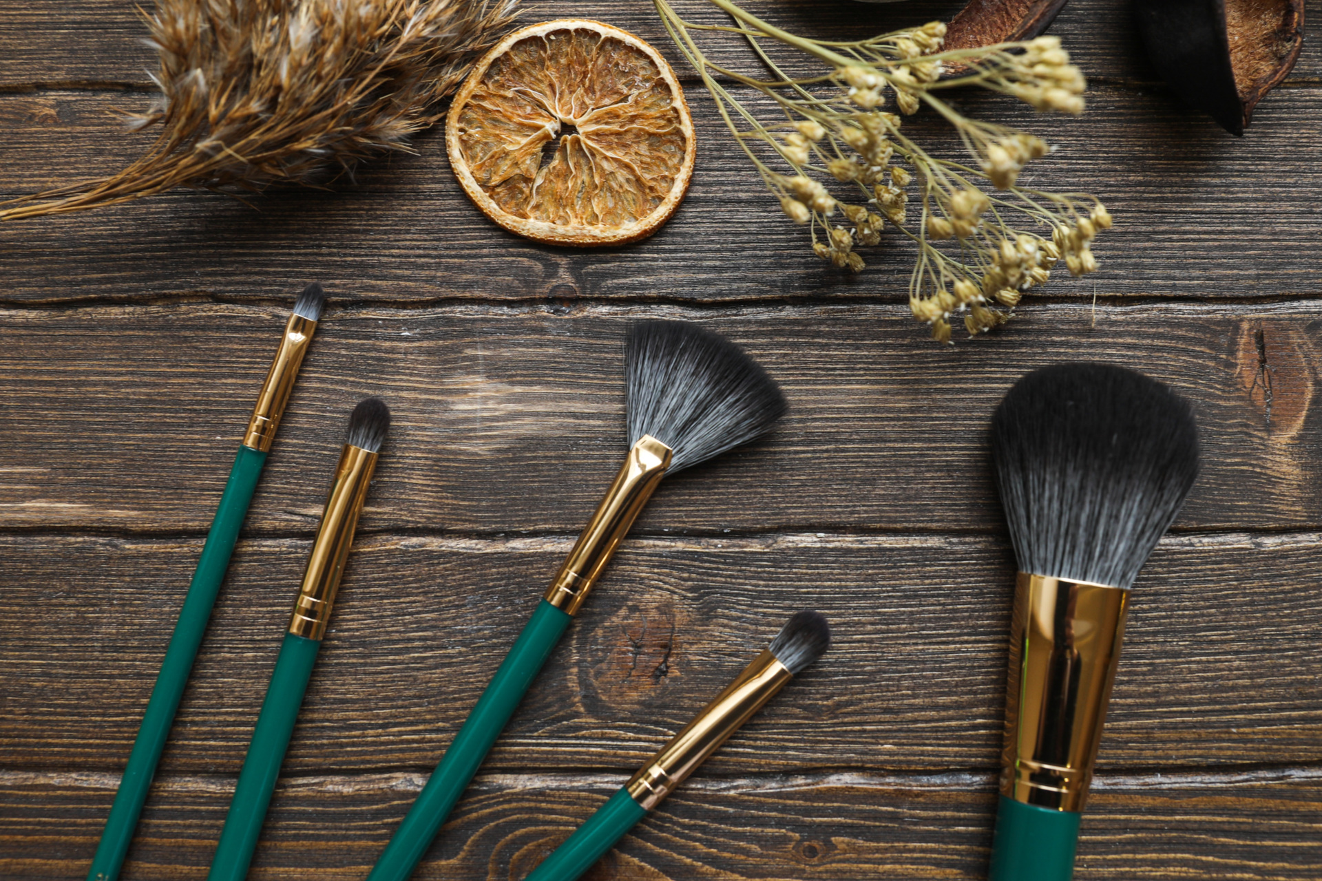 Makeup brushes on wooden table
