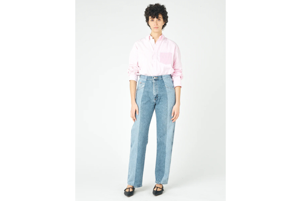 Woman in pink shirt and two-tone jeans