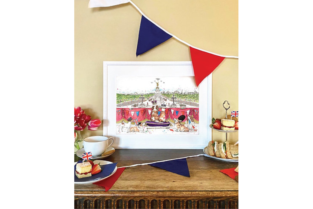 Pint set on table by bunting, tea and cake