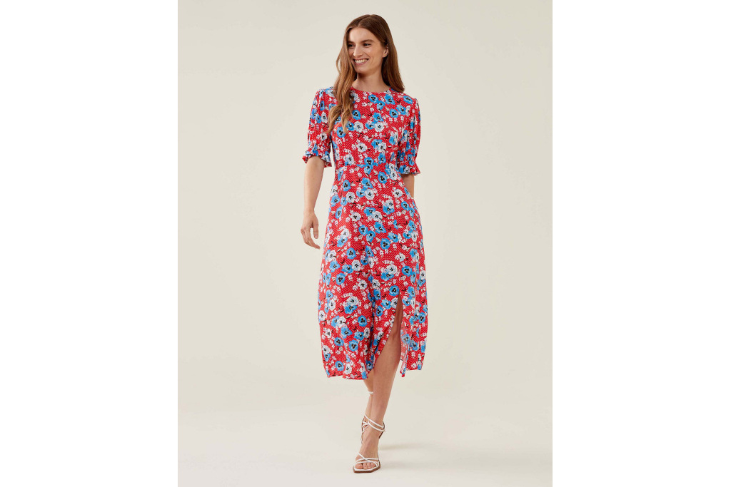 Woman in red dress with blue flowers