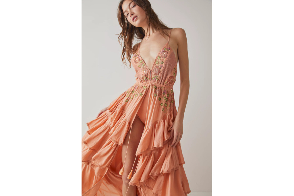 Woman in pink ruffle bodysuit