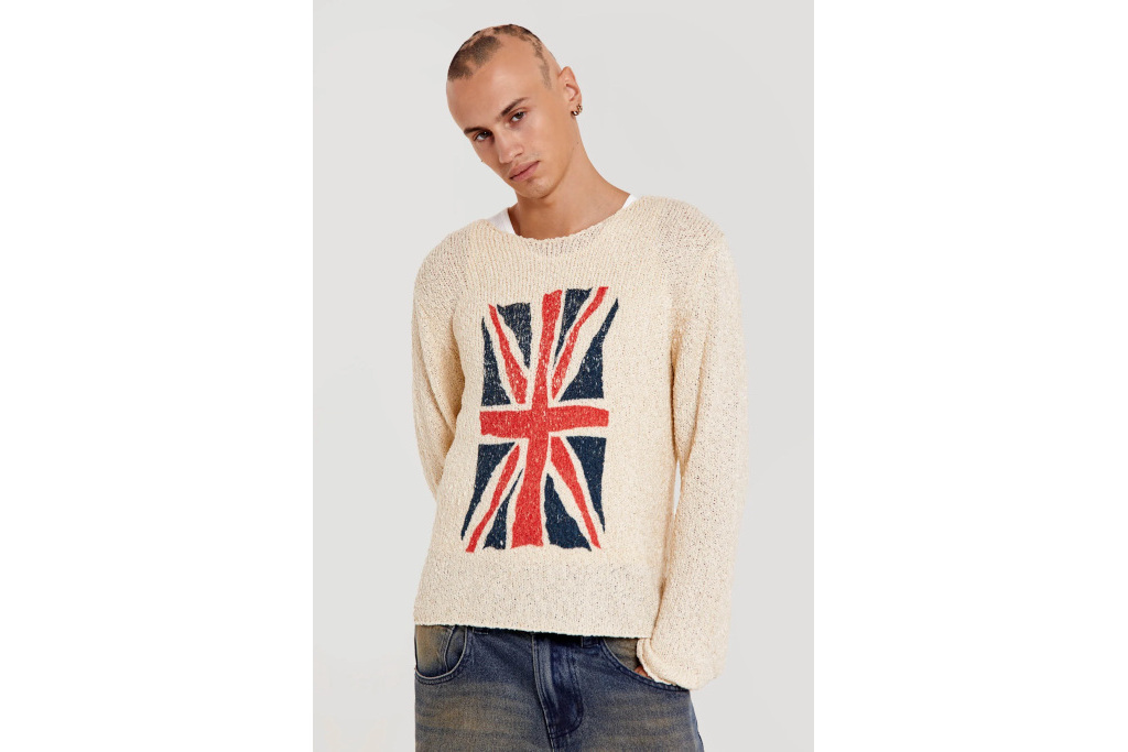 Man in cream jumper with Union Jack on the front