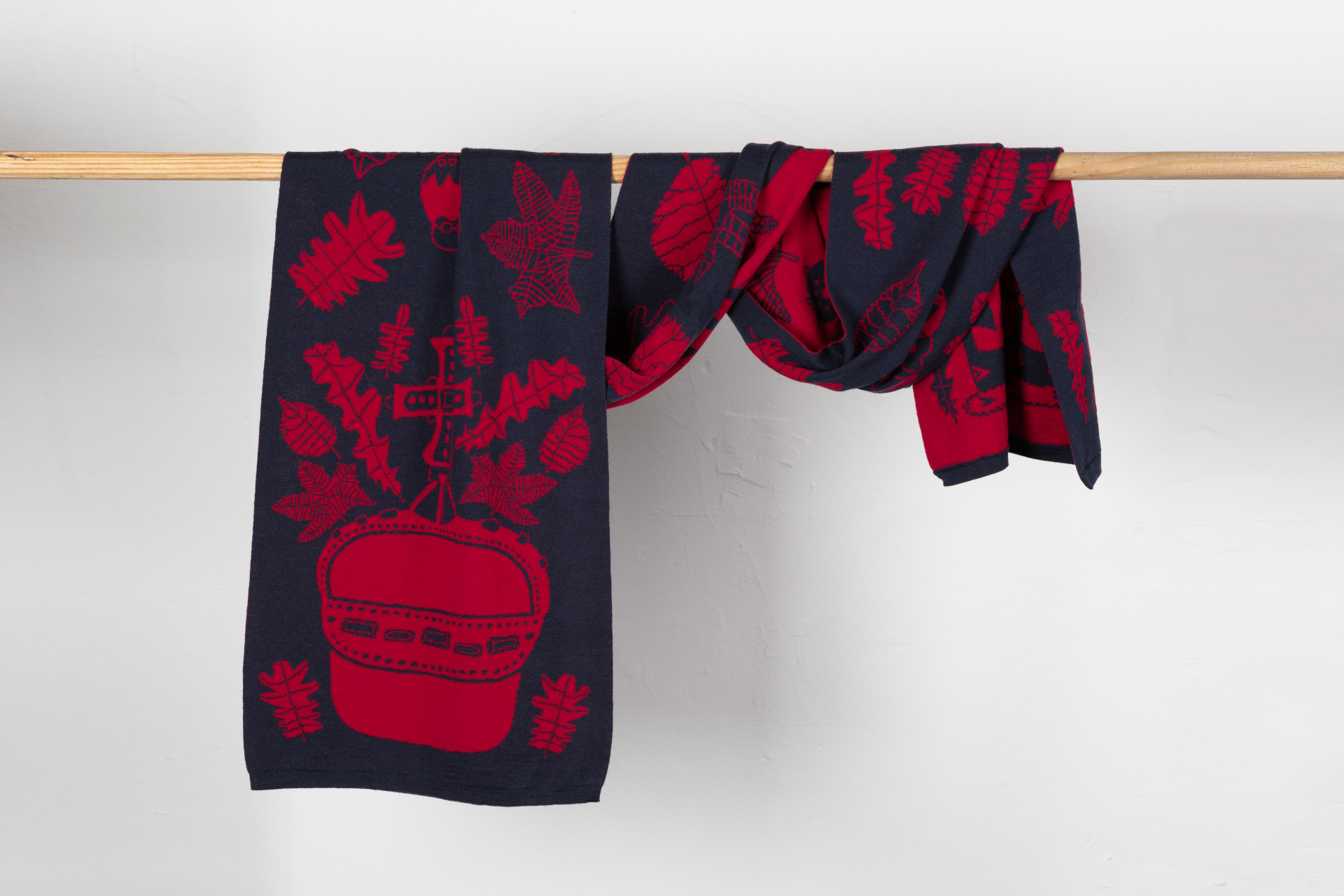 Red scarf wrapped around horizontal pole
