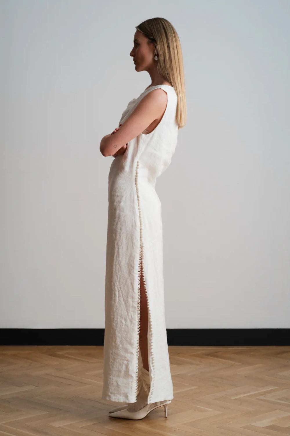 Woman in white linen dress