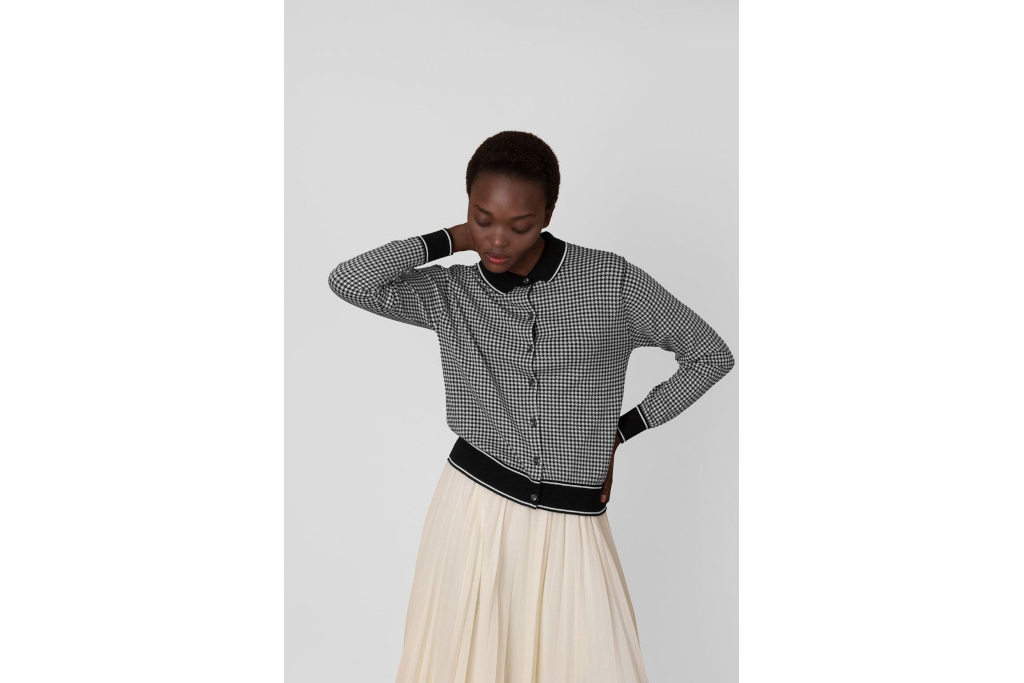 Woman in black gingham cardigan